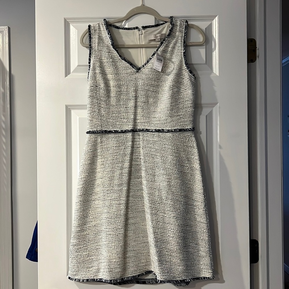 Sleeveless, knee length, v neck dress